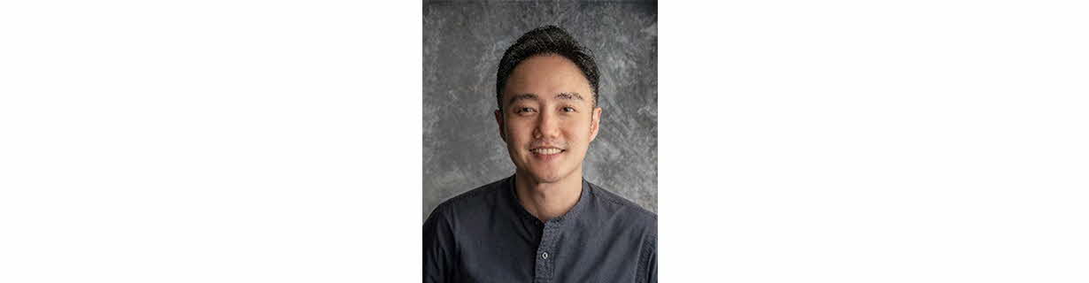 Portrait of Boo Junfeng, Man in grey shirt smiling